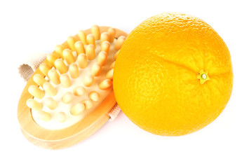 Fresh orange and a brush on white background isolated
