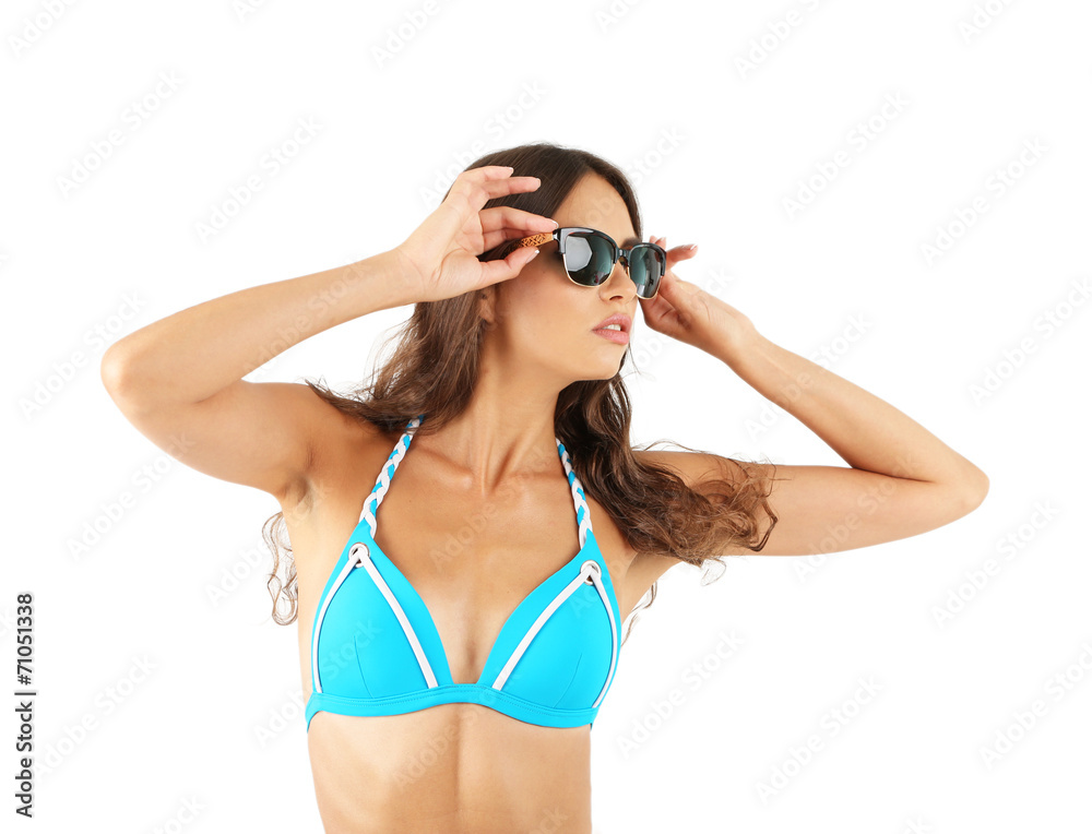 Wall mural Beautiful young woman in swimsuit isolated on white