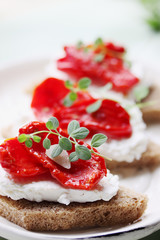 Canapes of cheese and sundried tomato