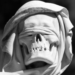 head of Grim reaper  sculpture on monumental cemetery
