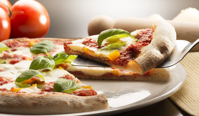 Pizza on the table with ingredients