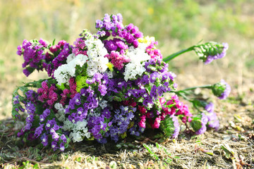 Beautiful bouquet of wildflowers on grass