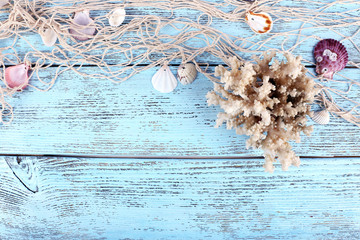Decor of seashells close-up on blue wooden table