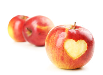 Red apple with heart isolated on white