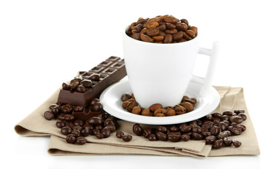 Cup with coffee beans and dark chocolate glaze, isolated