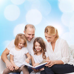 happy family with book at home