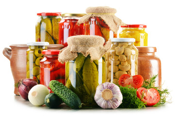 Composition with jars of pickled vegetables. Marinated food