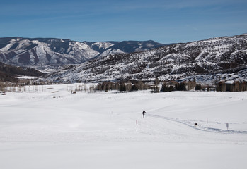A woman cross-country skiing at valley in Utah