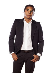 handsome African businessman standing on white background