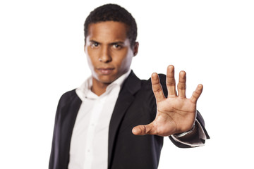 angry african guy showing stop hand