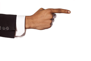 dark skinned hand in suit showing direction