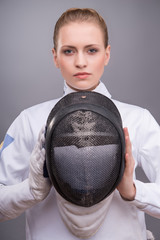 Young woman engaging in fencing