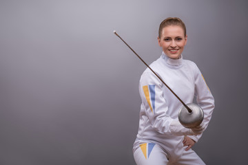 Young woman engaging in fencing