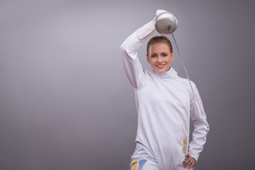 Young woman engaging in fencing