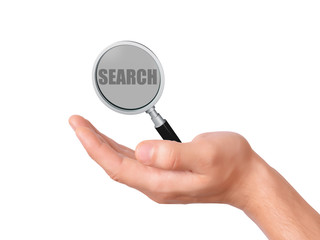 hand hold magnifier glass with search text