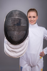 Young woman engaging in fencing