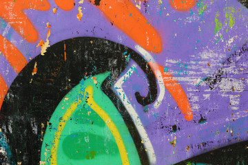Graffiti on a wall - detail of a graffiti painted on a wall