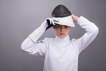 Young woman engaging in fencing