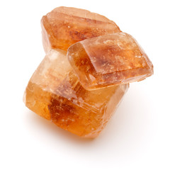 Brown caramelized lump cane sugar cube isolated on white backgro