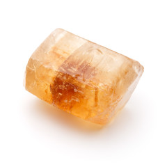 Brown caramelized lump cane sugar cube isolated on white backgro