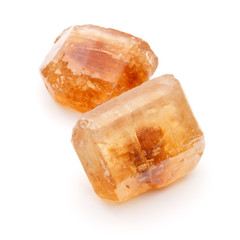 Brown caramelized lump cane sugar cube isolated on white backgro