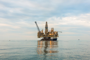 Oil rig platform in the calm sea