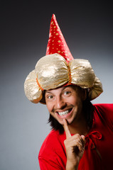 Funny wizard wearing red dress