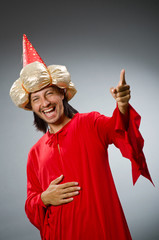 Fototapeta premium Funny wizard wearing red dress