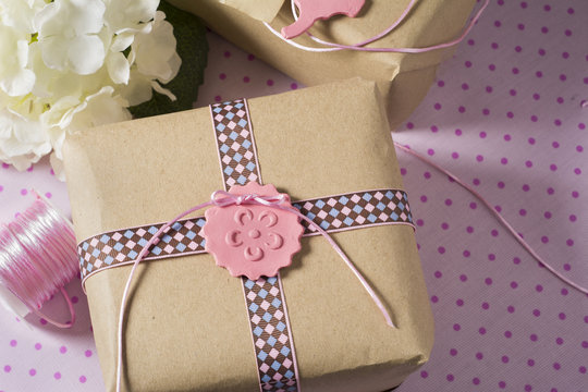 Gift wrapped in recyclable paper, ribbons and flower