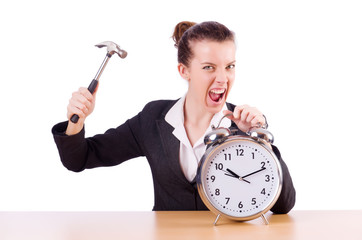 Woman desperate with time hitting clock with hammer © Elnur