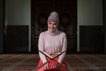 Muslim Woman Reading The Koran
