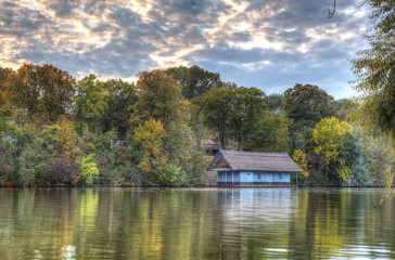 Fototapeta na wymiar Peaceful lake view with old cabin