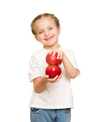 little girl with fruits and vegetables on white