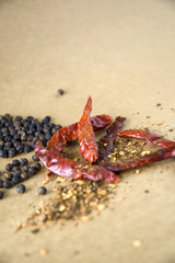 close up dried chili and black pepper