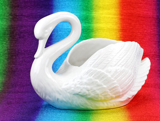 porcelain swan on a colored background