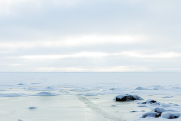 Fototapeta na wymiar frozen Icy coastline of the bay