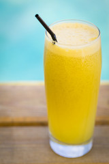 Fresh apple and orange juice on a wood