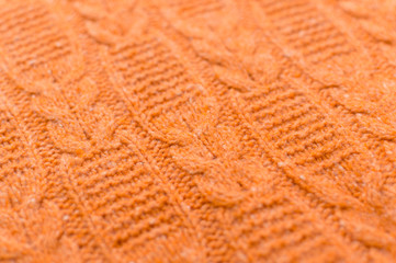 Closeup on Orange Handmade Knitted Fabric pattern