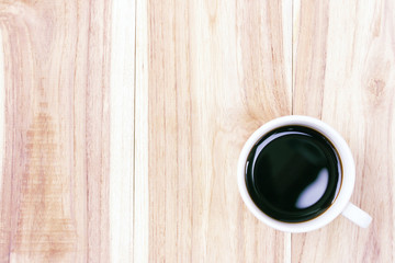 Black coffee on wood