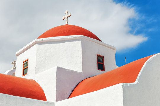Traditional orthodox white church with red cupola in Mykonos