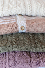 Fototapeta na wymiar picture of closeup on four wool sweaters in the column