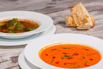 Picture of cold tasty tomato soup gazpacho with species on the w