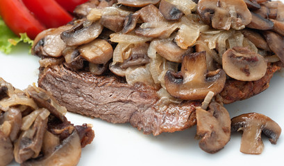 Fried beef with mushrooms and fresh tomatoes