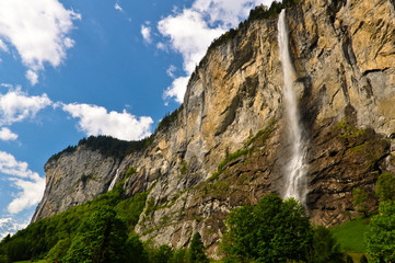 Fototapeta na wymiar Waterfall Falling from the Cliff in Lauterbrunnen Valley