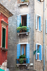 Facades of houses on a street in Venice, Italy