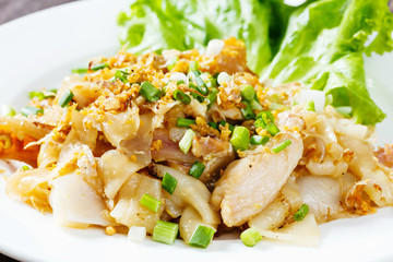 Stir fried fresh rice fat noodles with chicken and egg