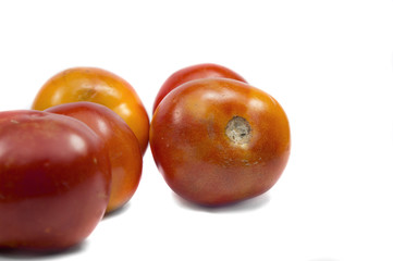 Fototapeta na wymiar Red tomatoes on white