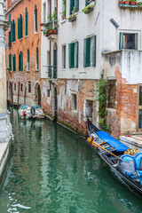 Fototapeta na wymiar Gondola Service on the canal in Venice, Italy