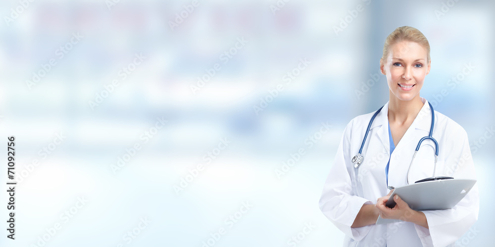 Wall mural female doctor over medical background.