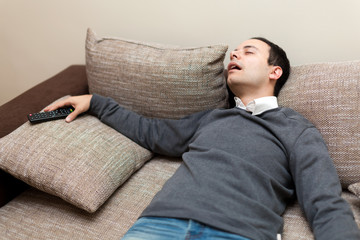 Man sleeping while watching tv